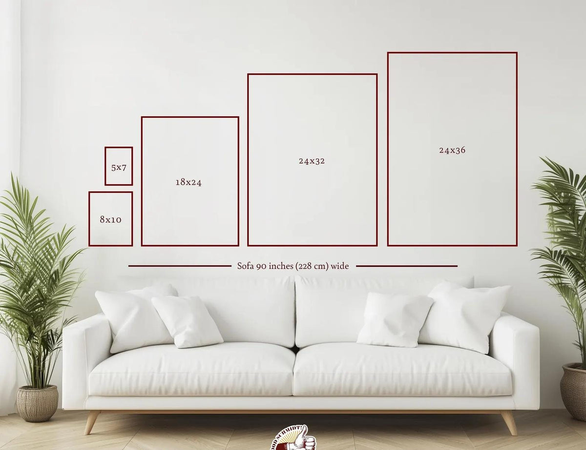 A white sofa measuring 90 inches wide positioned below six rectangular frames of varying sizes labeled 5x7, 8x10, 18x24, 24x32, and 24x36. The frames are outlined in dark red against a plain white wall, with two potted green plants.