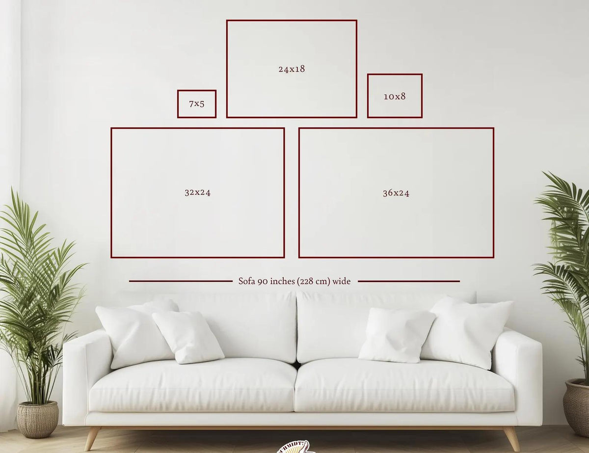 A wall display guide featuring five rectangular frames with dimensions 7x5, 24x18, 10x8, 32x24, and 36x24 inches, positioned above a white sofa that is 90 inches wide, providing a visual reference for art arrangement and sizing.
