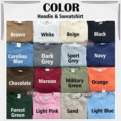 A color chart for hoodies and sweatshirts featuring fifteen folded garments in various shades including brown, white, beige, black, Carolina blue, dark grey, sport grey, navy, chocolate, maroon, military green, orange, forest green, light pink, sand, and light blue.