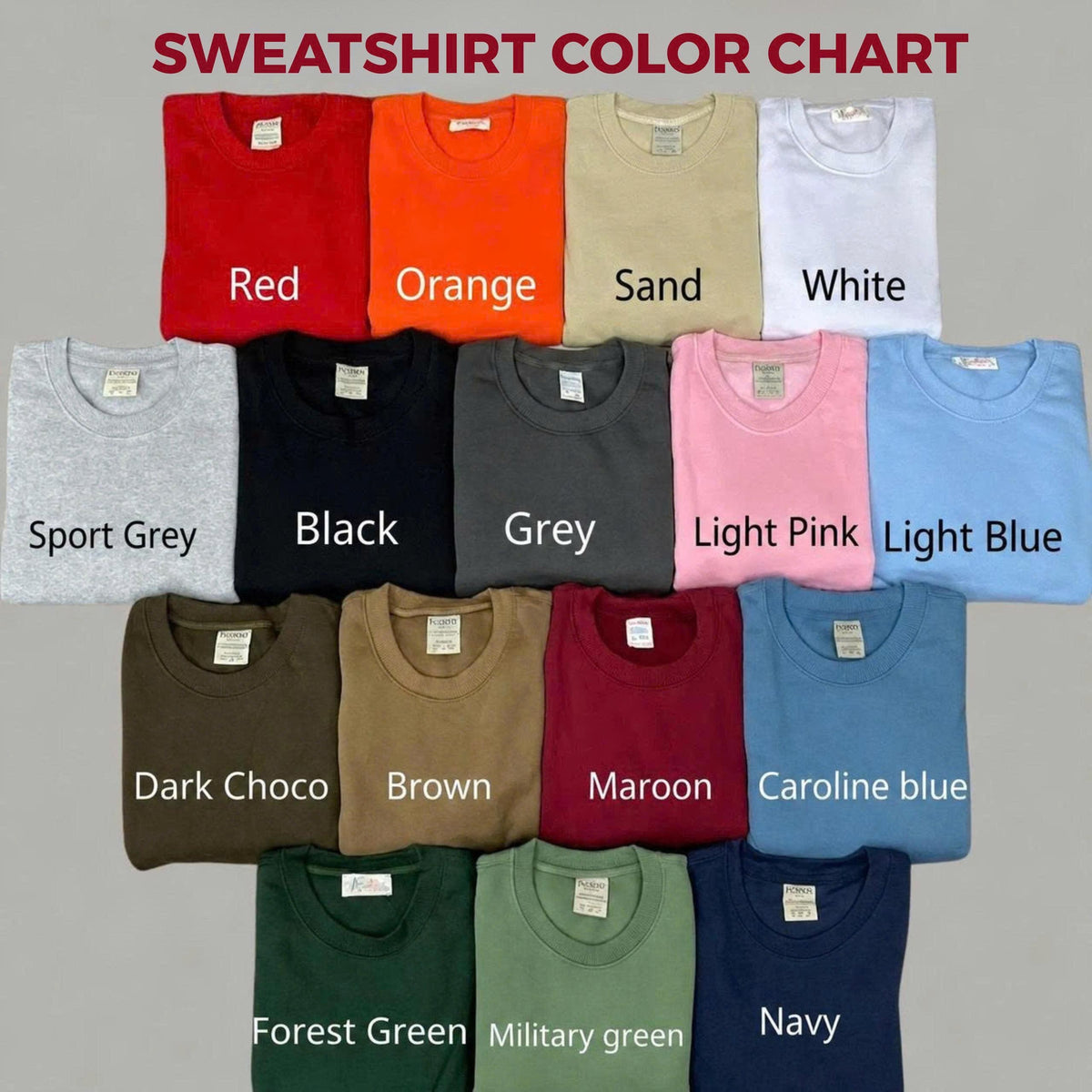 A sweatshirt color chart displaying fifteen folded crewneck sweatshirts in various colors including red, orange, sand, white, sport grey, black, grey, light pink, light blue, dark choco, brown, maroon, caroline blue, forest green, military green, and navy.