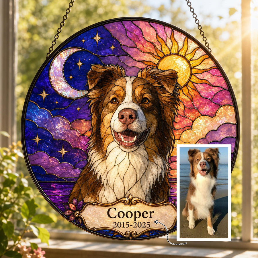 Stained glass pet memorial suncatcher featuring Bernese Mountain Dog with angel wings under moon and stars, vibrant purple and gold sky, round panel displayed in sunlight with small photo reference.