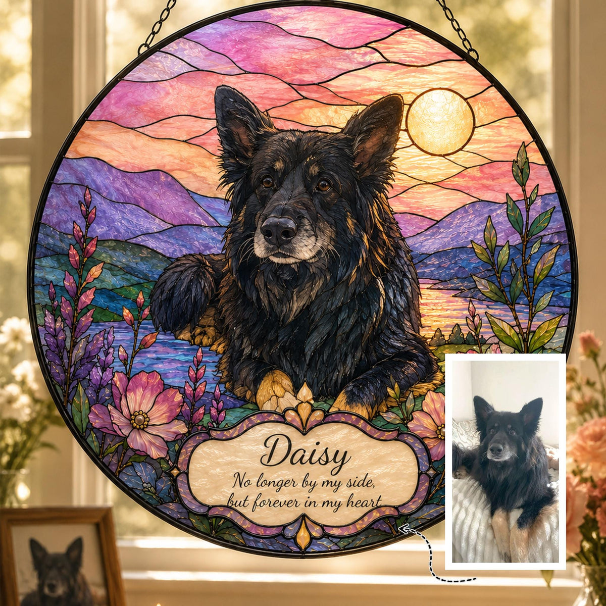 Black dog stained glass suncatcher with pastel mountain landscape and sunset sky, circular hanging design with engraved name and memorial dates.