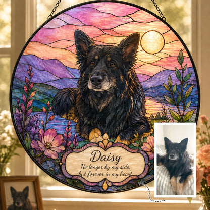Black dog stained glass suncatcher with pastel mountain landscape and sunset sky, circular hanging design with engraved name and memorial dates.