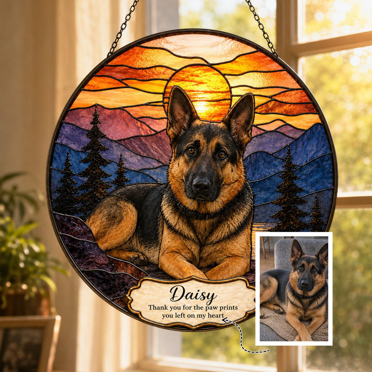German Shepherd stained glass suncatcher with sunset mountain scene, warm orange sky and detailed glass texture, displayed with reference photo.