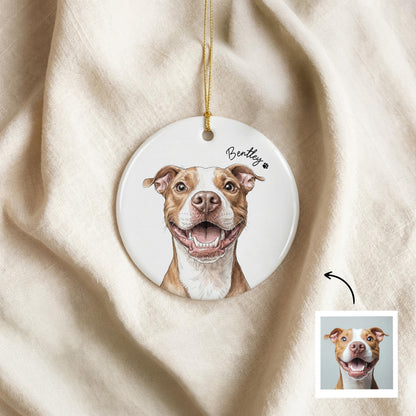 A round white ceramic ornament featuring a detailed illustration of a brown and white pit bull dog with an open-mouthed smile. The name Bentley is printed in black script above the dog, accompanied by a small black paw print icon.