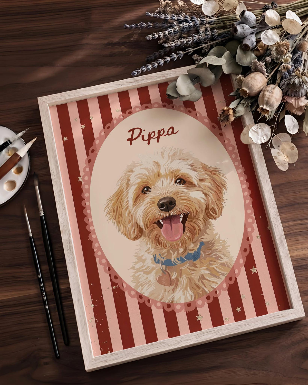 A framed portrait print featuring a golden-colored dog with a blue collar and heart-shaped tag. The dog is centered within an oval frame against a background of vertical red and cream stripes with small stars. The name Pippa is printed above.