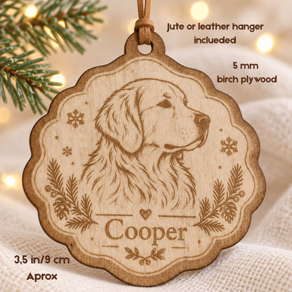 A scalloped 3.5 inch birch plywood ornament featuring a laser-engraved golden retriever portrait, snowflake accents, and pine branches. The name Cooper is engraved above a small heart. Includes a jute or leather hanger.