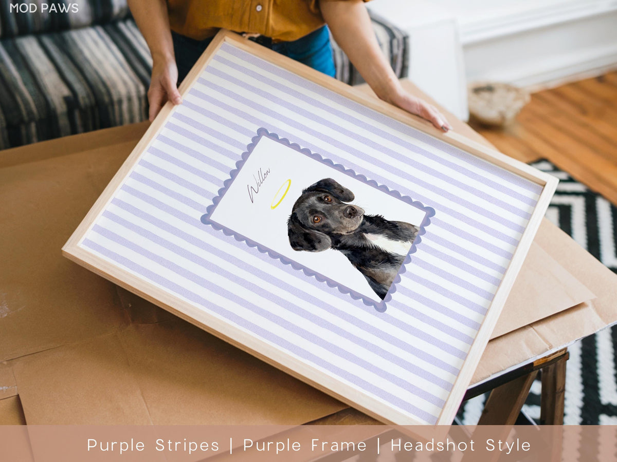 A framed print featuring a watercolor portrait of a black and white dog. The artwork is set against a background of lavender and white stripes. The frame is made of light-colored wood. The dog's name, "Willow", is written on the print.