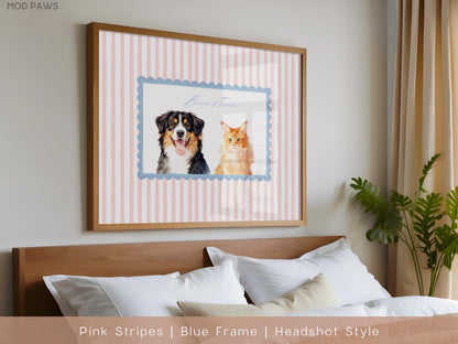 A framed print featuring a dog and a cat. The artwork is set against a pink and white striped background, with the animals inside a blue scalloped frame. The frame is a light brown color.
