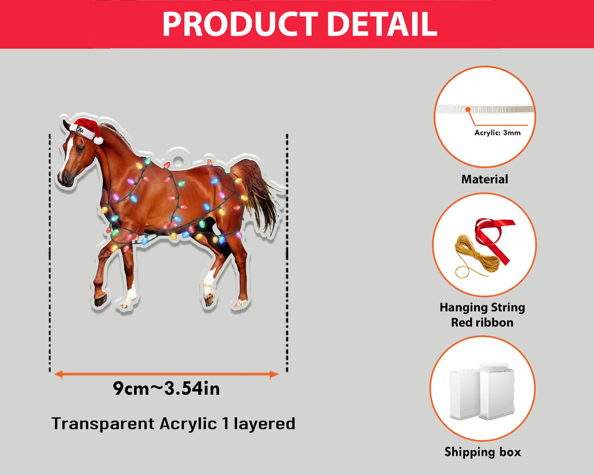 A transparent acrylic horse ornament, 3.54 inches wide, with a Santa hat and Christmas lights. The horse is brown with white markings and is designed to be layered. Includes a red ribbon and hanging string.
