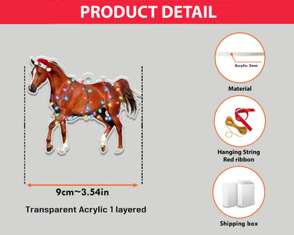 A transparent acrylic horse ornament, 3.54 inches wide, with a Santa hat and Christmas lights. The horse is brown with white markings and is designed to be layered. Includes a red ribbon and hanging string.