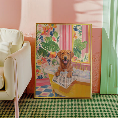 A framed print of a brown Labrador Retriever in a yellow bathtub filled with bubbles. The dog is holding a newspaper that reads "THE DAILY BARK". The background features floral wallpaper and a pink wall.