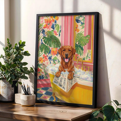 Framed art print featuring a brown Labrador Retriever in a yellow bathtub filled with bubbles. The dog is holding a newspaper that reads "THE DAILY BARK." The background includes floral wallpaper and a pink striped curtain.