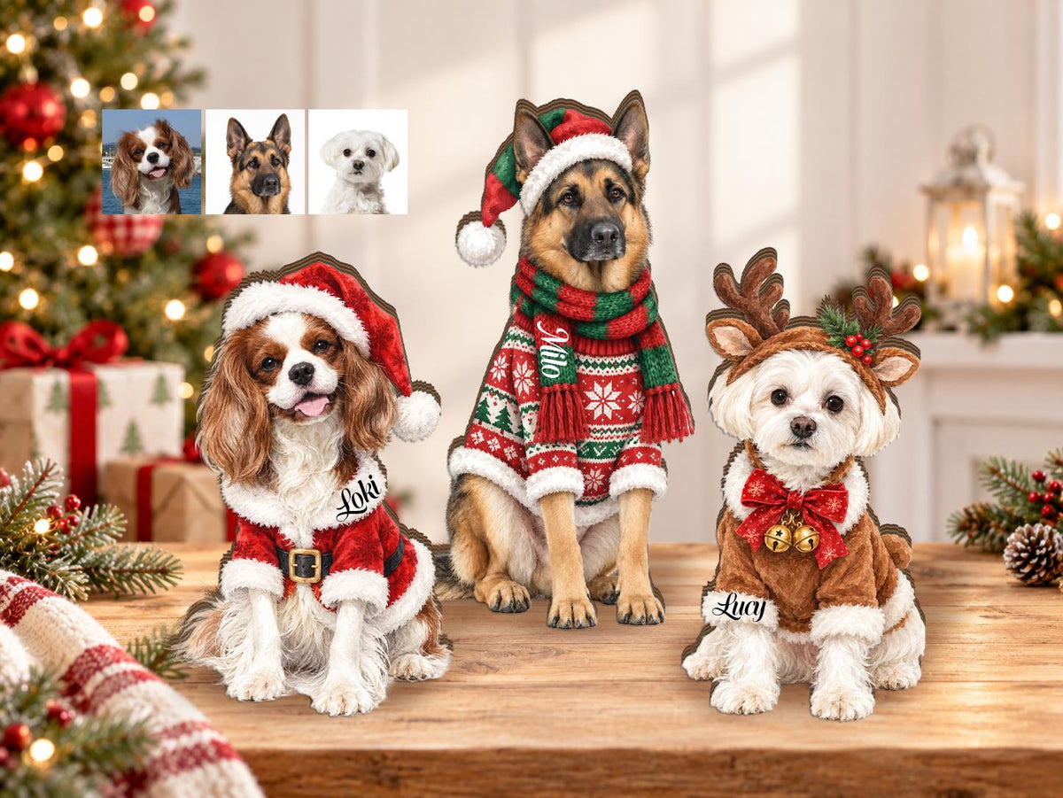 Three custom wooden dog ornaments featuring a Cavalier King Charles Spaniel in a Santa suit, a German Shepherd in a festive sweater and hat, and a white dog with reindeer antlers, each personalized with names Loki, Milo, and Lucy.
