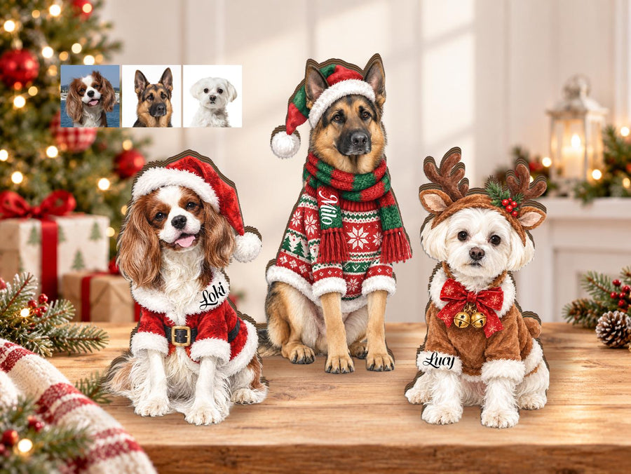 Three custom wooden dog ornaments featuring a Cavalier King Charles Spaniel in a Santa suit, a German Shepherd in a festive sweater and hat, and a white dog with reindeer antlers, each personalized with names Loki, Milo, and Lucy.