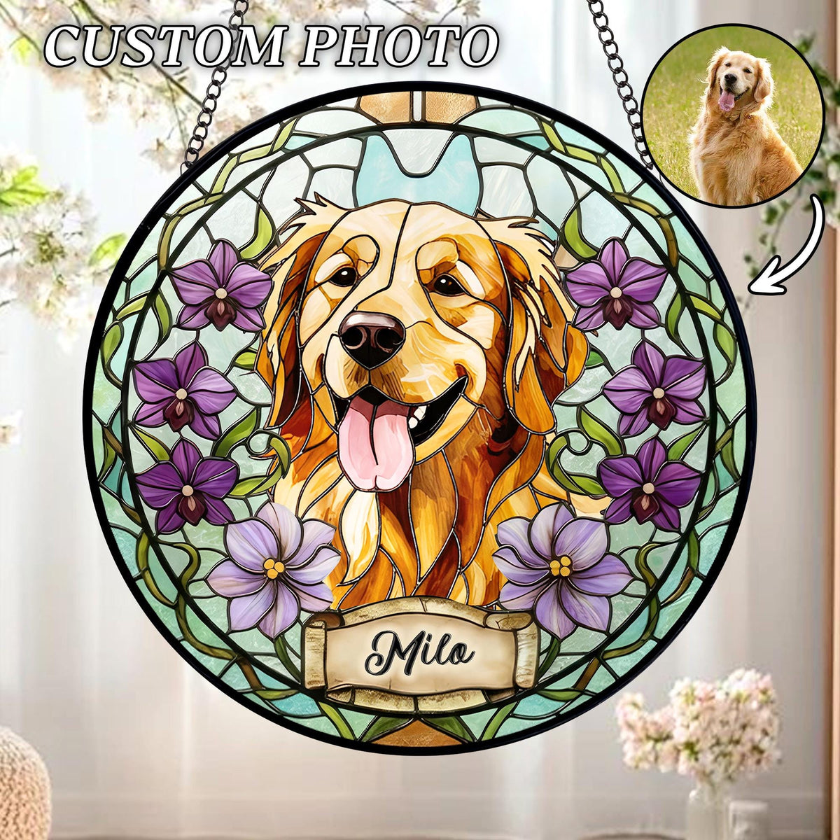 Stained glass window featuring a Golden Retriever with a happy expression, surrounded by purple flowers. The window has a black border and a chain for hanging. The name "Milo" is displayed on a banner at the bottom. The words "CUSTOM PHOTO" are at the top.