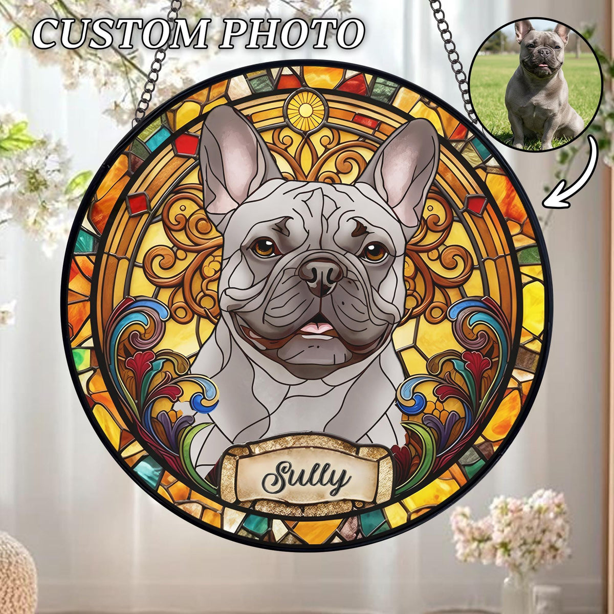 A round stained glass window featuring a gray French Bulldog with the name "Sully" on a banner. The window has a black border and is decorated with colorful, intricate patterns in shades of yellow, orange, red, and blue. The text "CUSTOM PHOTO" is at the top.