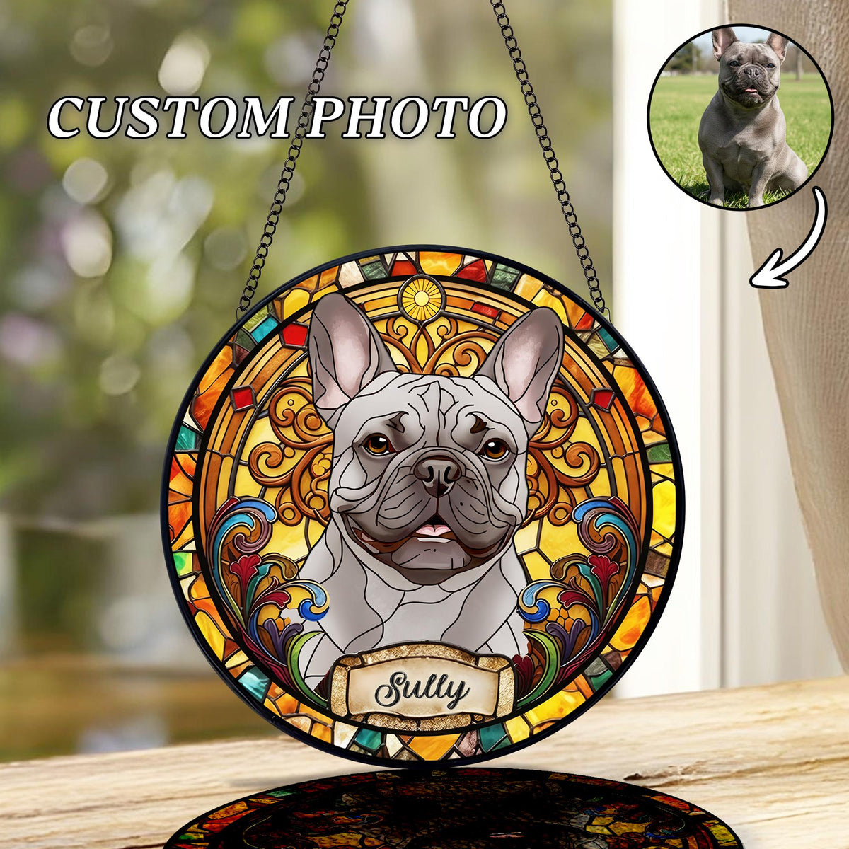 Round stained glass window featuring a gray French Bulldog with the name "Sully" on a banner. The window has a colorful, ornate border and is suspended by a chain. The text "CUSTOM PHOTO" is at the top.