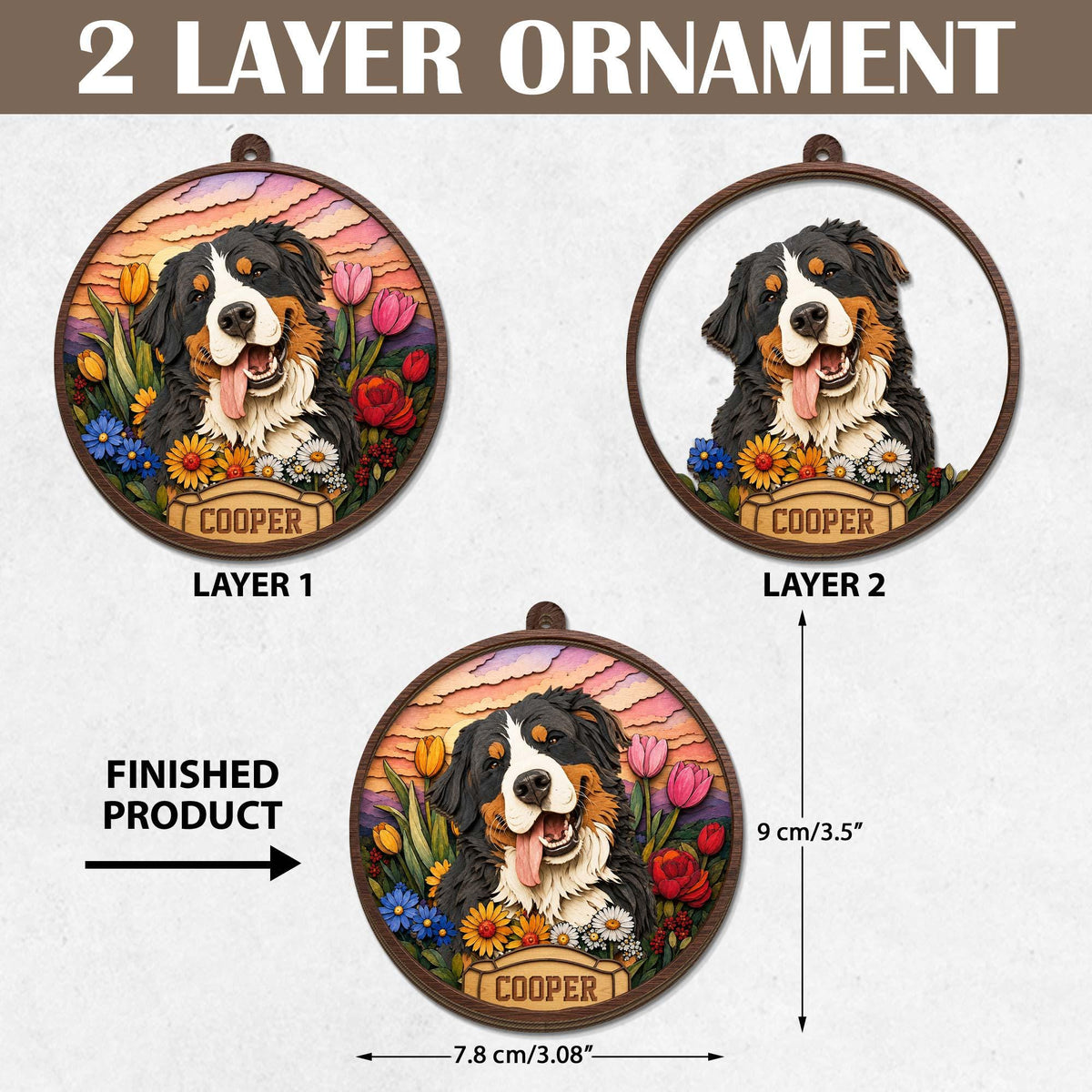 A two-layer circular ornament featuring a Bernese Mountain Dog illustration with the name COOPER printed on a banner. The design includes colorful tulips and daisies. The ornament measures 3.5 inches in height and 3.08 inches in width.