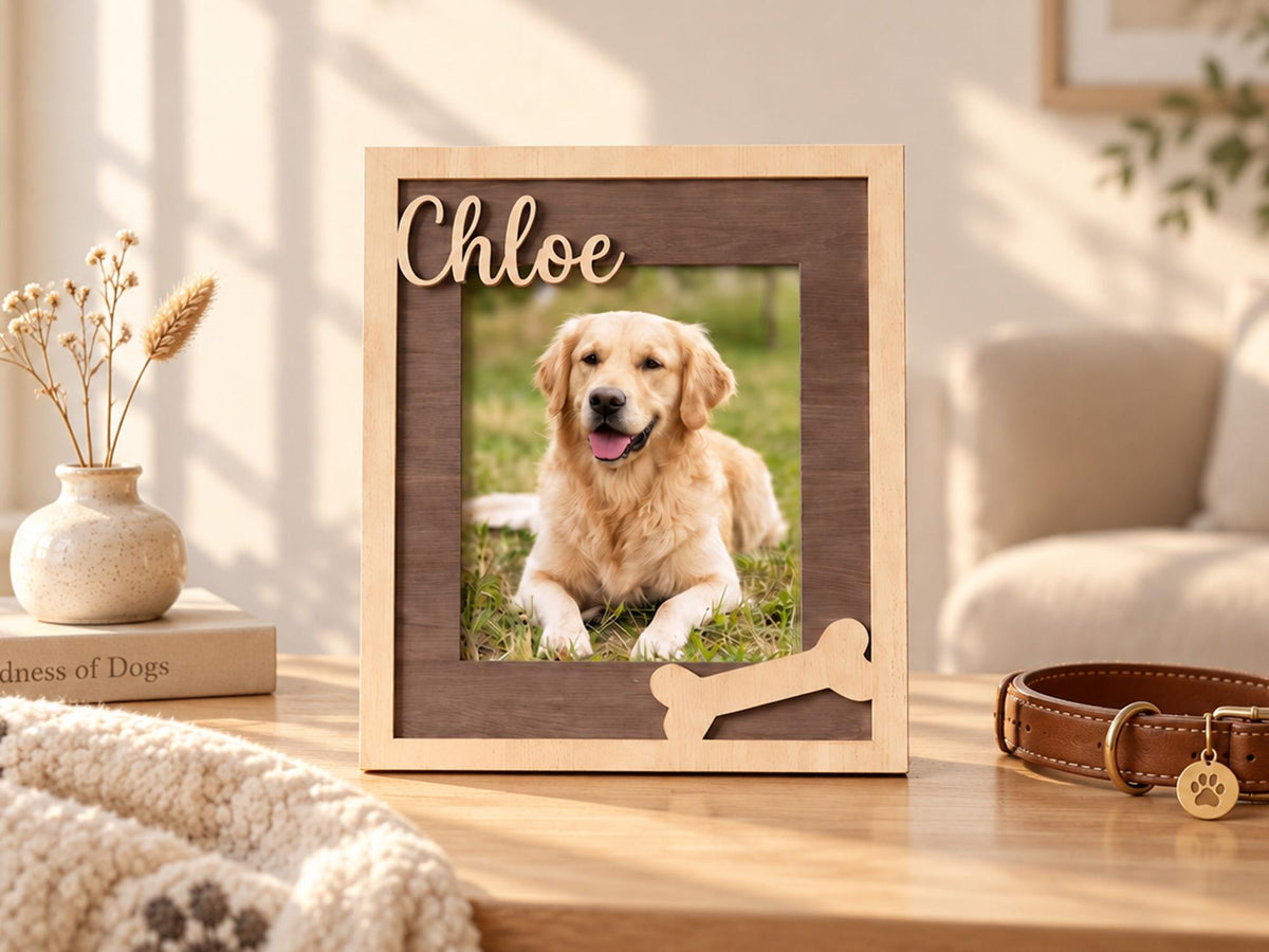 A rectangular wooden picture frame with a light wood outer border and a dark wood inner frame. The name Chloe is cut out in light wood script at the top left, and a light wood bone shape is attached at the bottom right corner.