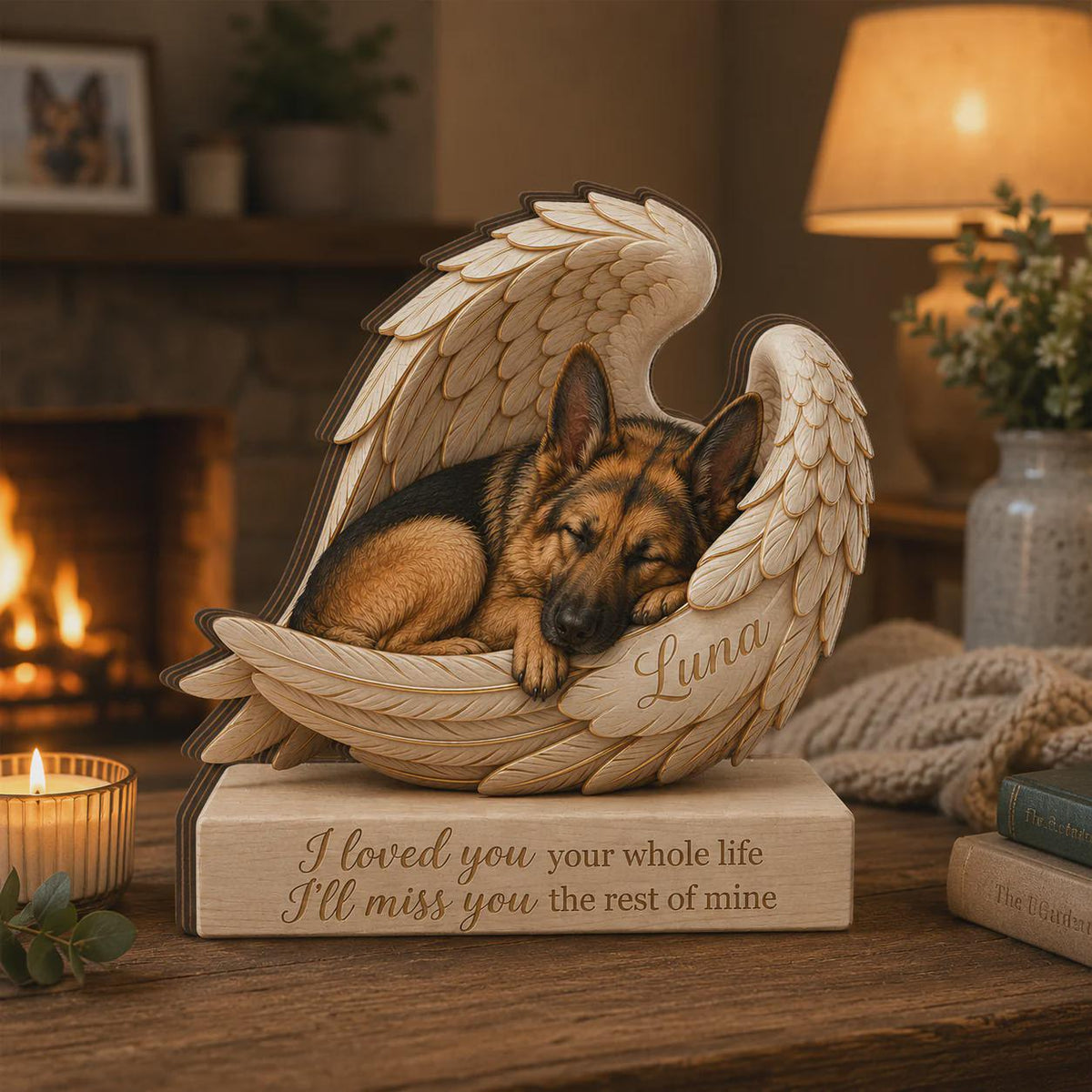 A wooden memorial sculpture featuring a German Shepherd dog sleeping inside a pair of carved angel wings. The name Luna is engraved on the wing, and the base is inscribed with the text: I loved you your whole life I'll miss you the rest of mine.