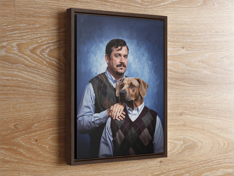 A framed portrait featuring a person with dark hair and a mustache wearing a light blue button-down shirt and a dark green argyle sweater vest, with a hand resting on the shoulder of a brown dog wearing a matching argyle sweater vest.