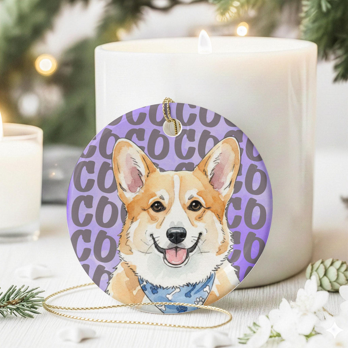 A round ceramic ornament featuring a watercolor illustration of a tan and white Corgi dog wearing a blue bandana with a bone pattern. The background is a light purple color with the repeated text COCO in a dark purple font.